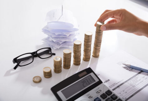 Accountant Stacking Coins On Desk. Save Money Concept